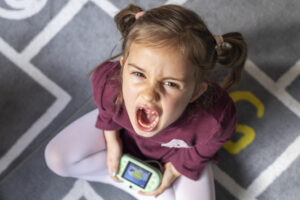 portrait-little-girl-upset-because-game